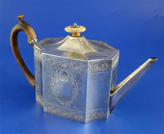 A George III bright cut engraved silver teapot, gross 13 oz.